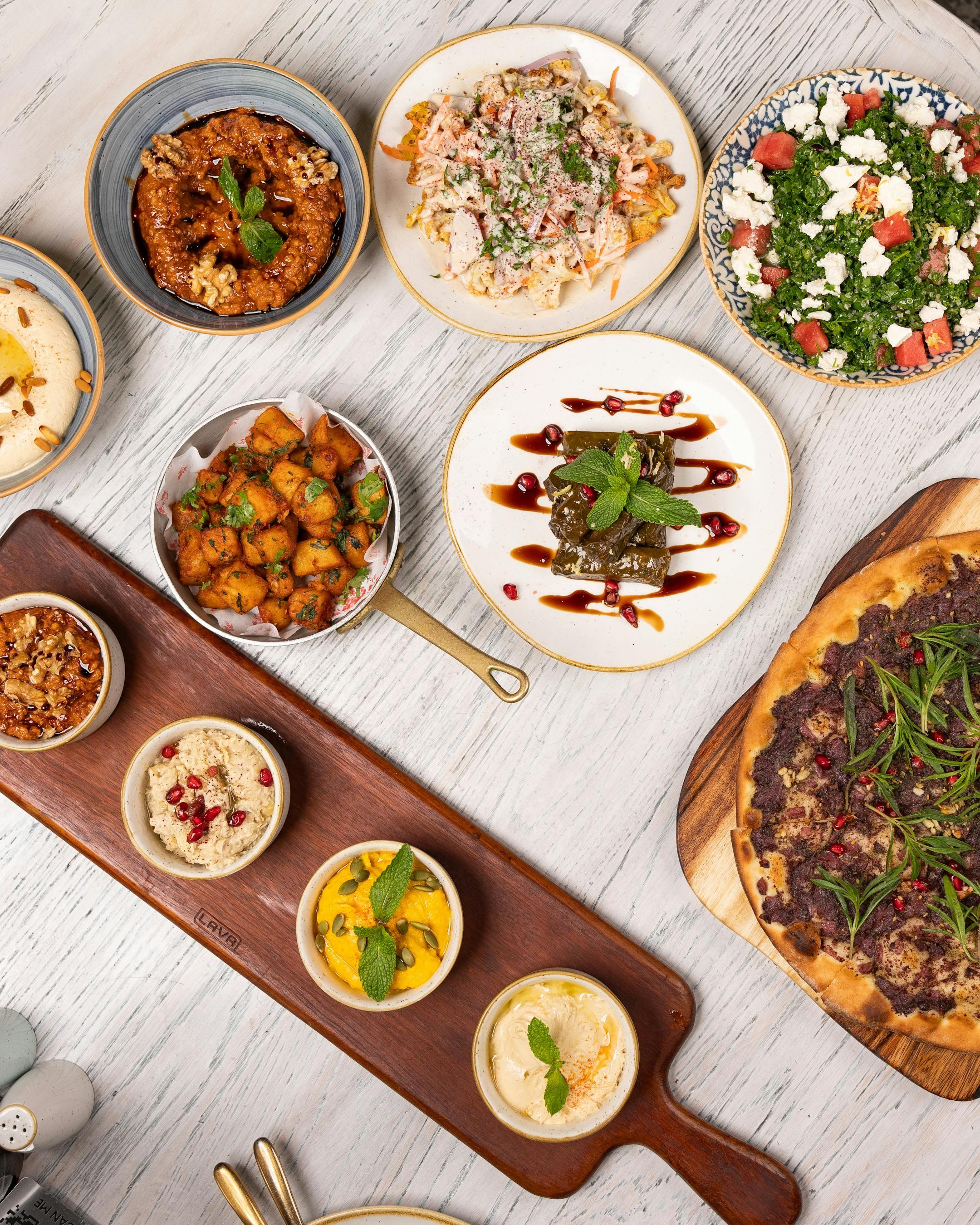 Selection of rich, colourful dishes on a tray